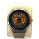 A PORSCHE DESIGN WRISTWATCH, BY I.W.C. serial number 2628257, the gold face with baton hour markers,