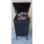 A MUSOLA CABINET GRAMOPHONE the ebonized case with a record storage compartment, overall 96.5cm