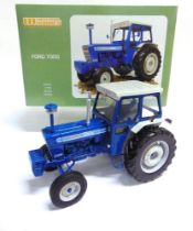 A 1/16 SCALE UNIVERSAL HOBBIES FORD 7000 blue and pale grey, mint or near mint, boxed.