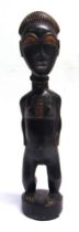 ETHNOGRAPHICA / TRIBAL ART - AN AFRICAN STANDING FEMALE FIGURE with a partially ebonized finish,