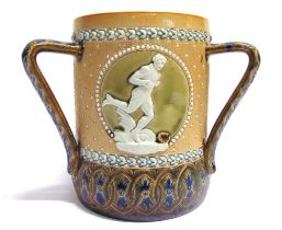 [FOOTBALL INTEREST]. A DOULTON LAMBETH STONEWARE THREE-HANDLED LOVING CUP the sides with three
