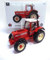 A 1/16 SCALE UNIVERSAL HOBBIES INTERNATIONAL 1455XL (1983) red and black, limited edition of 2000,