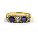 ESTATE DIAMOND & SAPPHIRE 18CT GOLD RING Two round mixed cut sapphires estimated to total 1.00