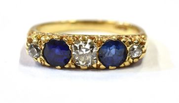 ESTATE DIAMOND & SAPPHIRE 18CT GOLD RING Two round mixed cut sapphires estimated to total 1.00