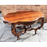 A FRENCH STYLE HARDWOOD CENTRE TABLE 20th century, the shaped top with a floral and foliate carved