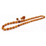 BUTTERSCOTCH AMBER NECKLACE 64cm long, continuously strung oblong amber beads, approx 9.2-13.6mm