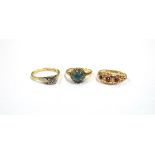 THREE GEM SET RINGS IN 15 & 18CT GOLD To include a ruby and single cut diamond eternity,