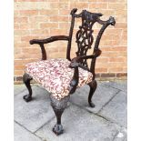 A CHIPPENDALE STYLE CARVED MAHOGANY CARVER CHAIR 19th century, decorated with flower heads, swags,