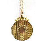 9CT GOLD LOCKET & CHAIN 24.1mm diameter round locket decorated with linear engine turning and a