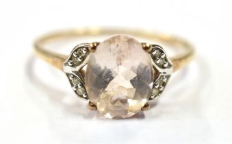 9CT GOLD & ROSE DANBURITE RING Central claw set oval mixed cut rose danburite, reported as 2.53