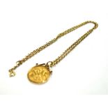 HALF SOVEREIGN WITH 9CT GOLD CHAIN A spectacle set half sovereign dated 1914, on a 9ct gold