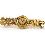 15CT GOLD DIAMOND SET BAR BROOCH 4.3cm long, decorated with canetille work and a star grain set