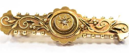 15CT GOLD DIAMOND SET BAR BROOCH 4.3cm long, decorated with canetille work and a star grain set