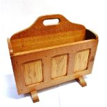 A KNIGHTMAN FAMILY OLD MILL FURNITURE OAK MAGAZINE RACK with recessed knight's head trademark,