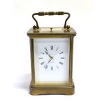 A BRASS CASED CARRIAGE CLOCK, MATTHEW NORMAN, LONDON with repeat mechanism, the white enamel face