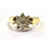 18CT GOLD DIAMOND SET CLUSTER RING Central white gold, tiered floral cluster set with single cut