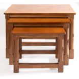 A ROBERT MOUSEMAN THOMPSON WORKSHOP (KILBURN) OAK NEST OF THREE TABLES each with an adzed