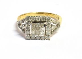 9CT GOLD & DIAMOND RING 11.8mm square head, with central bezel and grain set princess and