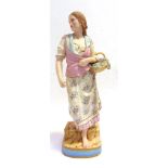 A COPELAND COLOURED PARIAN FIGURE 'ADVERSITY' in standing pose and carrying a basket of flowers,