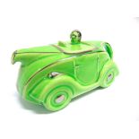 A SADLER NOVELTY TEAPOT IN THE FORM OF A MOTOR CAR green with silver highlights and the registration