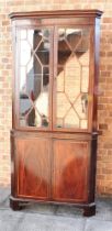 AN INLAID MAHOGANY STANDING CORNER CUPBOARD the upper section with a pair of astragal glazed doors