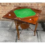 AN EDWARDIAN MAHOGANY ENVELOPE CARD TABLE the baize lined interior with dished counter wells, with