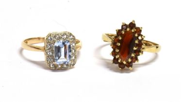 TWO GEM SET 9CT GOLD RINGS One octagonal step cut blue topaz, surrounded by single cut white topaz