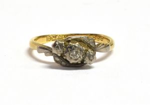 18CT GOLD & DIAMOND RING Platinum overlaid, illusion setting three single cut diamonds, with