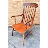 A WINDSOR ELBOW CHAIR with spindle backrest and dished seat, height 107cm, width 58cm