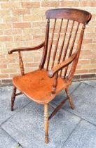 A WINDSOR ELBOW CHAIR with spindle backrest and dished seat, height 107cm, width 58cm