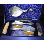 CASED SILVER MOUNTED DRESSING TABLE SET To include sterling silver mounted hair brushes, clothes