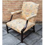 A GEORGE III 'GAINSBOROUGH' ARMCHAIR with a camel back, padded armrests and an overstuffed seat,
