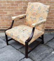 A GEORGE III 'GAINSBOROUGH' ARMCHAIR with a camel back, padded armrests and an overstuffed seat,