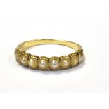 ANTIQUE HALF PEARL 18CT GOLD RING Tests as 18ct gold and mille grain set with nine half pearls, in