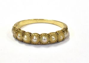 ANTIQUE HALF PEARL 18CT GOLD RING Tests as 18ct gold and mille grain set with nine half pearls, in
