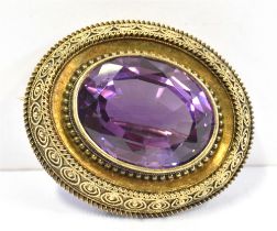 GEORGIAN AMETHYST BROOCH 9ct gold brooch with a fine canetille frame surrounding an oval mixed cut