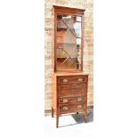 AN EDWARDIAN INLAID MAHOGANY TALL CABINET the upper glazed section with three shelves and with