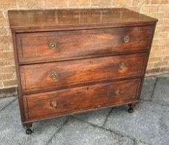 AN EDWARDIANMAHOGANY INLAID CHEST of three long graduated drawers with brass ring handles and on