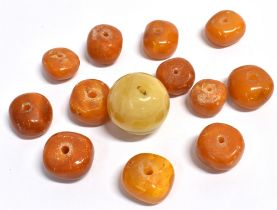 RAW AMBER BEADS Twelve irregular shaped raw amber beads, ranging from 15.0-20.5mm diameter and 9.5-