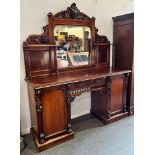 A VICTORIAN MIRROR BACK SIDEBOARD well carved with vine leaves and grapes, the central mirror back