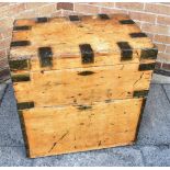 A RECTANGULAR METAL BOUND PINE TRUNK with pair of brass carrying handles and fall front cupboard