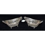 PAIR OF ANTIQUE SILVER FOOTED DISHES 17.0cm long x 9.0cm wide approx, on acanthus and paw feet, with