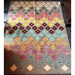 AN ANATOLIAN TURKISH KILIM of geometric design on a beige ground, 190cm x 147cm