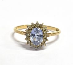 CEYLONESE SAPPHIRE & DIAMOND RING Central oval mixed cut 'ceylonese' sapphire, estimated 1.5 carats,