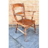 A WINDSOR ELBOW CHAIR with bar back and on four splayed supports, height 94cm, width 56cm