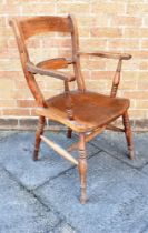 A WINDSOR ELBOW CHAIR with bar back and on four splayed supports, height 94cm, width 56cm