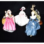 FOUR ROYAL DOULTON FIGURES AND ANOTHER: HN2698 'Sunday Best', HN2287 'Symphony' HN2234 'Fragrance'