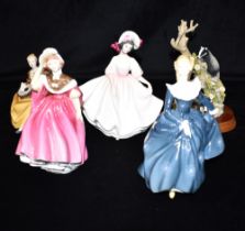 FOUR ROYAL DOULTON FIGURES AND ANOTHER: HN2698 'Sunday Best', HN2287 'Symphony' HN2234 'Fragrance'