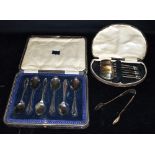 CASED SILVER TEASPOONS & SUGAR TONGS Two sets of six silver teaspoons in presentation cases also a