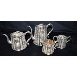 VINTAGE ORIENTAL SILVER TEA SERVICE To include a coffee and teapot, lidded sugar bowl and jug,